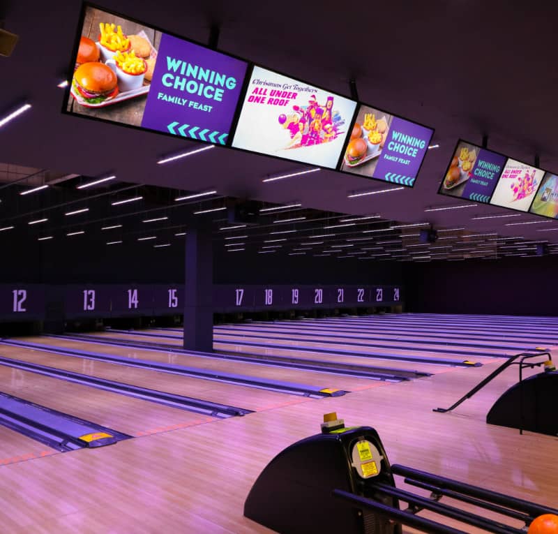 Digital signage used at a bowling alley to promote food and drink promotions