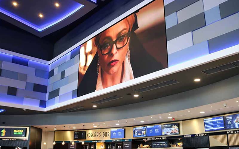 Large format digital signage screen in a Birmingham cinema showing trailers
