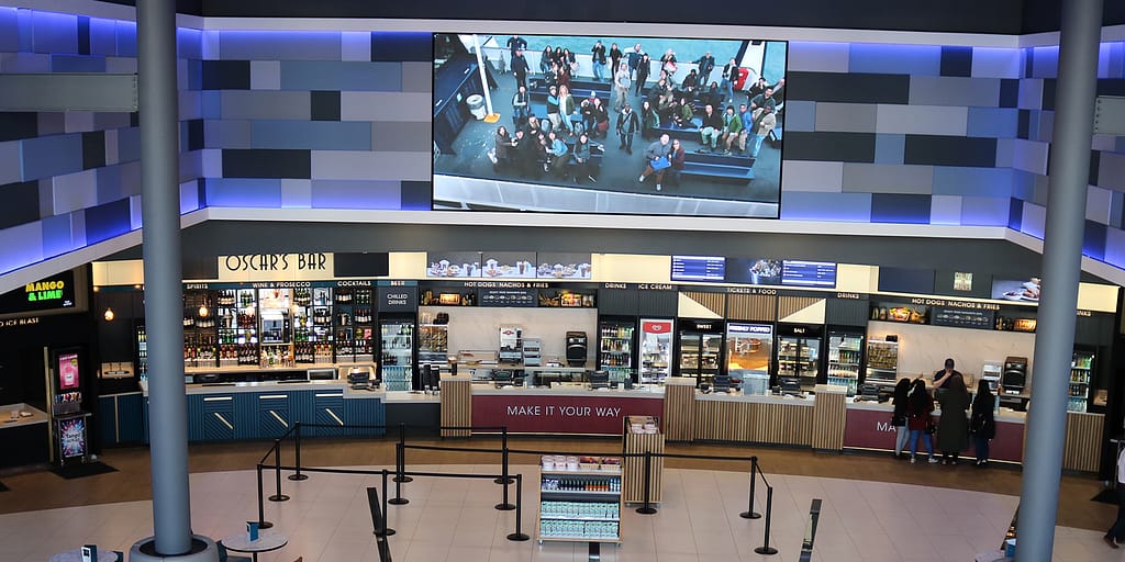 LED wall and digital menu boards in the foyer of an ODEON Luxe cinema in Birmingham, UK