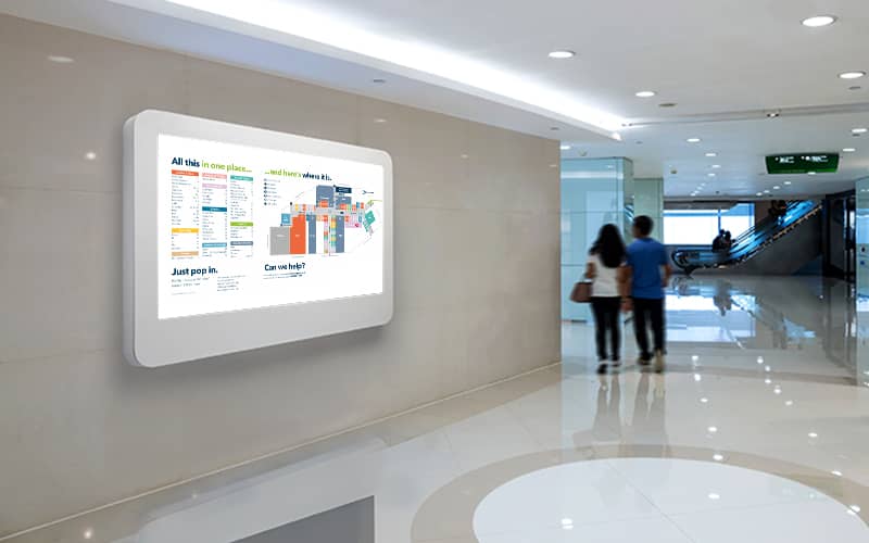 Wall-mounted wayfinding digital signage in a shopping mall