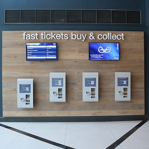 Diigital signage screens and self-service kiosks at a UK cinema