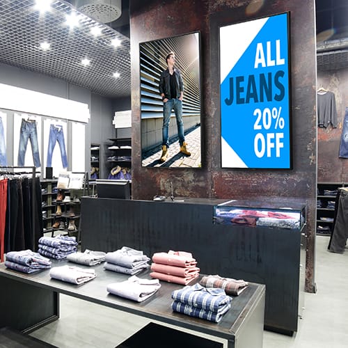Retail Digital Signage | NEC digital signage showing promotions in a clothing retail store