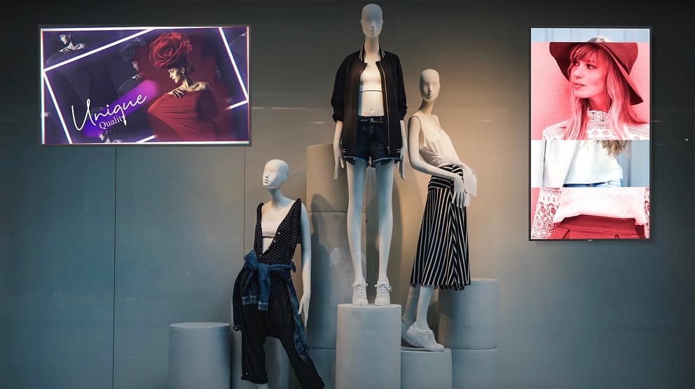 Digital signage window displays in clothing retail store