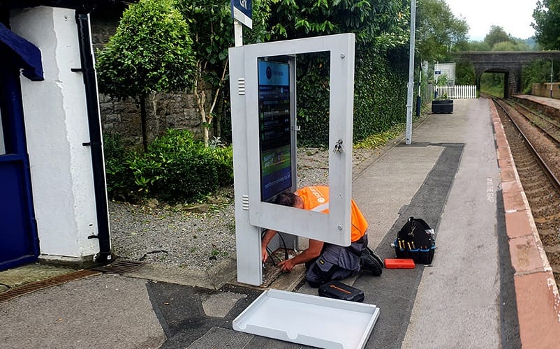 Outdoor digital signage freestanding totem and an installation engineer