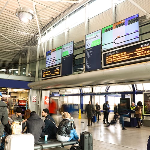 Passenger information displayed on digital signage screens at Manchester Piccadilly railway station