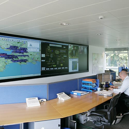 Digital signage showing staff information in a control room
